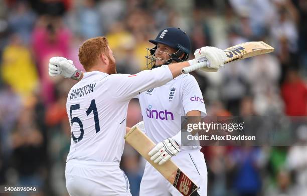 Jonny Bairstow of England celebrates reaching his century with Joe Root during Day Five of the Fifth LV=Insurance Test Match at Edgbaston on July 05,...