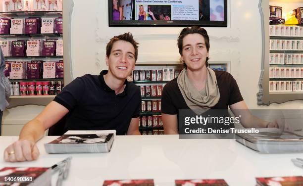 Harry Potter" cast members Oliver Phelps and James Phelps sign autographs at Sugar Factory at Paris Las Vegas on March 4, 2012 in Las Vegas, Nevada.