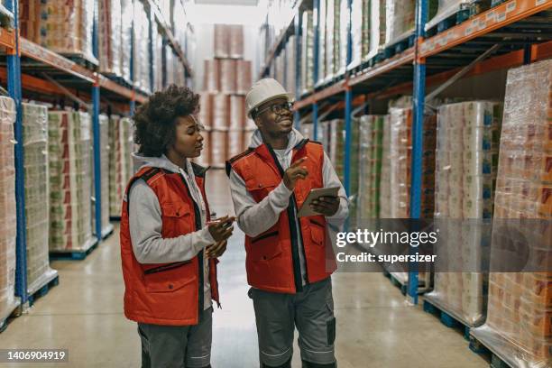 we need to ship these tomorrow - orange uniform stock pictures, royalty-free photos & images