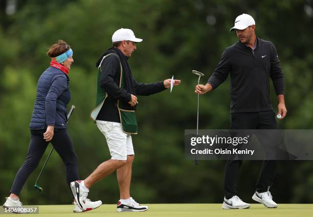 Brooks Koepka of United States with caddie Ricky Elliott of Port Rush at the 7th green during Day Two of the JP McManus Pro-Am at Adare Manor on July...