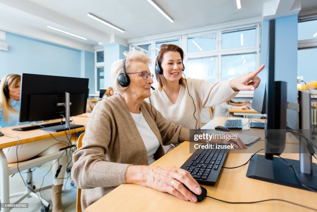 Manager Computer Training Manager Explaining Senior Trainee Using Computer High-Res Stock Photo ...