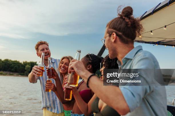 stylish casual friends on river - non moving activity stock pictures, royalty-free photos & images