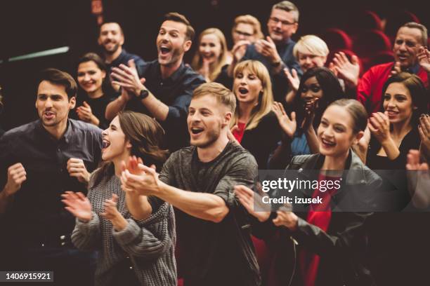 happy audience applauding in the theater - play concert stock pictures, royalty-free photos & images