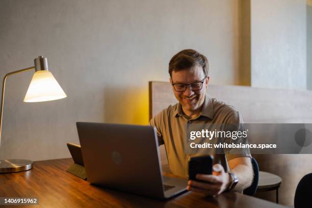 businessman using computer working remotely in public space - shareholders meeting stock pictures, royalty-free photos & images