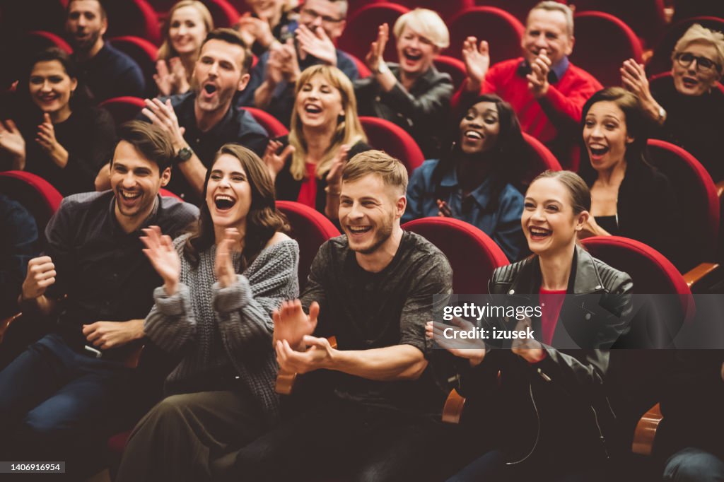 Happy audience applauding in the theater