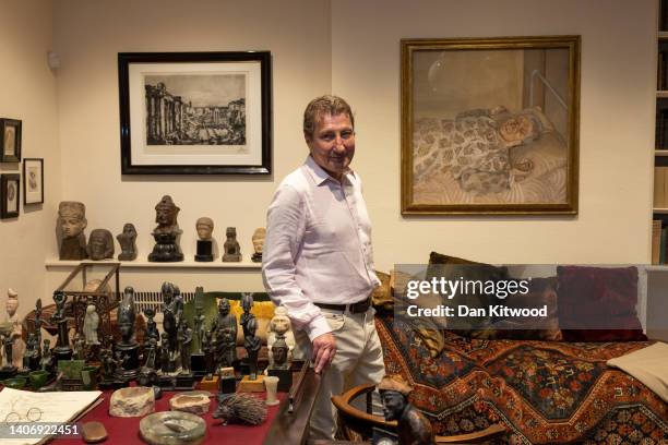 Lucian Freud's son Alex Boyt poses next to a painting of his grandmother, 'The painter's mother resting' during a photocall to mark a new exhibition...