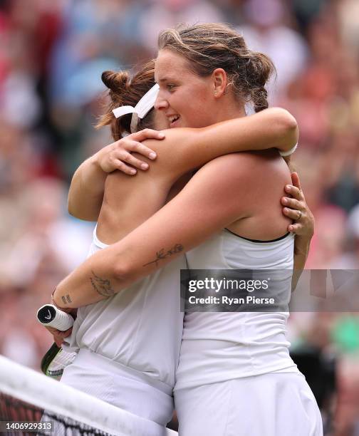 Tatjana Maria of Germany interacts with Jule Niemeier of Germany after winning their Women's Singles Quarter Final match on day nine of The...