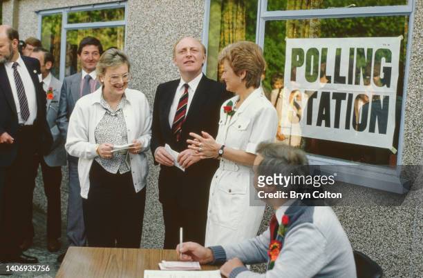 Neil Kinnock, Labour Party Leader and his wife Glenys Kinnock, collect their ballot papers at the Pontllanfraith polling station ahead of voting in...
