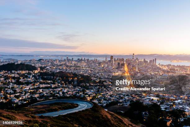 illuminated san francisco skyline seen from twin peaks, california, usa - twin peaks stock pictures, royalty-free photos & images