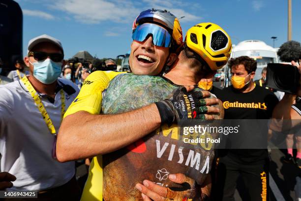 Wout Van Aert of Belgium and Team Jumbo - Visma Yellow Leader Jersey celebrates with a teammate at finish line as stage winner during the 109th Tour...