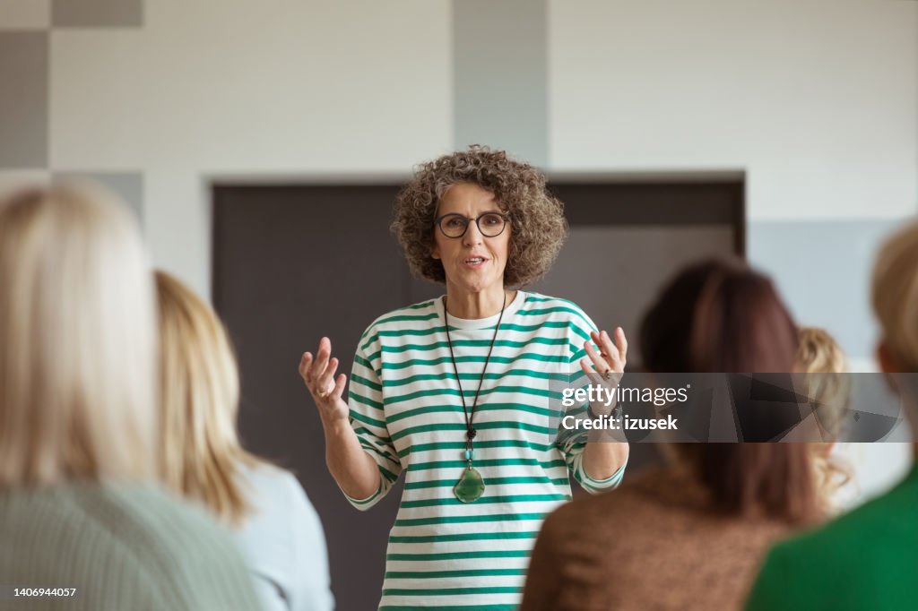Woman sharing experience during seminar