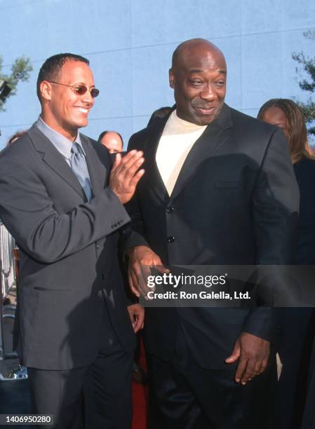 American actor and professional wrestler Dwayne Johnson and actor Michael Clarke Duncan attend a premiere of 'The Mummy Returns' at the Universal...