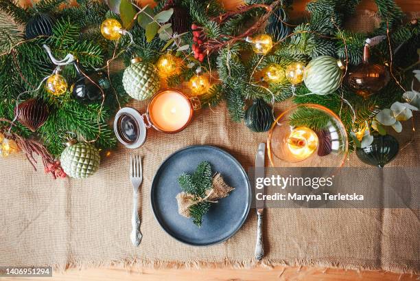 new year's table setting in rustic style. christmas background. new year card. place for text. decorations for the winter holiday. - decoration foto e immagini stock