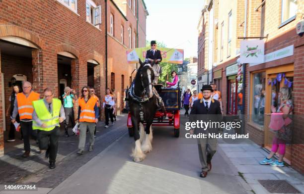 Baton bearer Kathryn Marygold holds the Queen's Baton during the Birmingham 2022 Queen's Baton Relay at a visit to Devizes, United Kingdom on July...