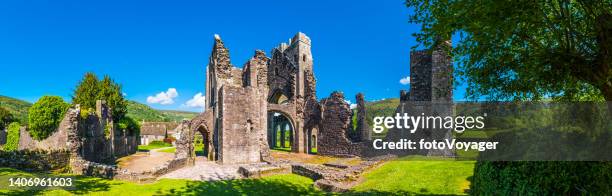 medieval ruins of llanthony priory deep in black mountains panorama - black mountain pass stock pictures, royalty-free photos & images