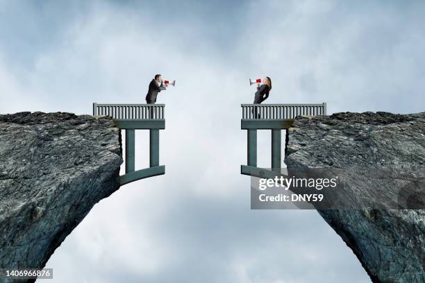 man and woman using megaphones to communicate - estabelecer uma ponte imagens e fotografias de stock