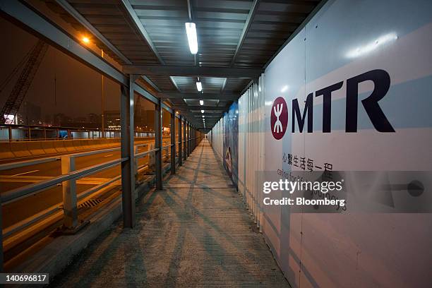 The MTR Corp. Logo is displayed at a construction site in Hong Kong, China, on Sunday, March 4, 2012. MTR is scheduled to announce earnings on March...