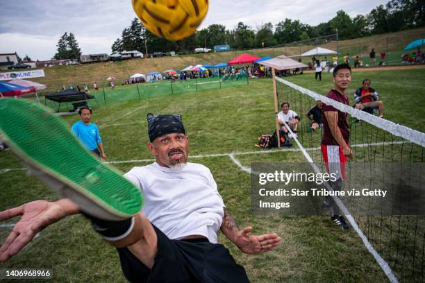 Tommy Vang returns the ball in a game of Sepak Takraw at the Hmong International Freedom Festival at Como Park in St. Paul, Minn., on Sunday, July 3,...