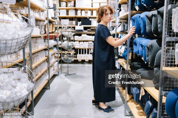 woman shopping in the department store - neck pillow stock pictures, royalty-free photos & images