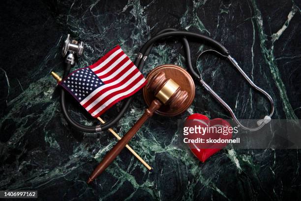health care and legal concept with stethoscope on green marble background - congress background stock pictures, royalty-free photos & images