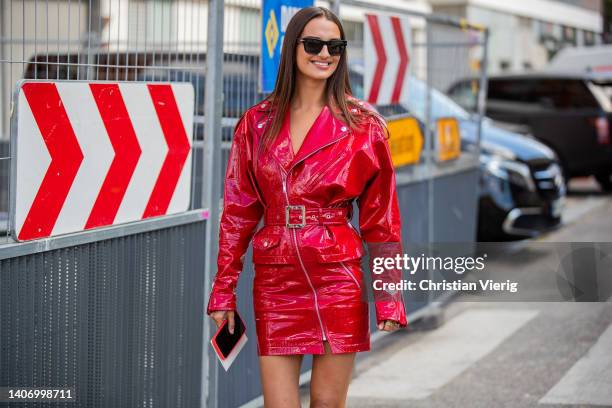 Gabrielle Caunesil seen wearing red latex belted jacket, skirt outside Alexandre Vauthier Paris Fashion Week - Haute Couture Fall Winter 2022 2023 :...