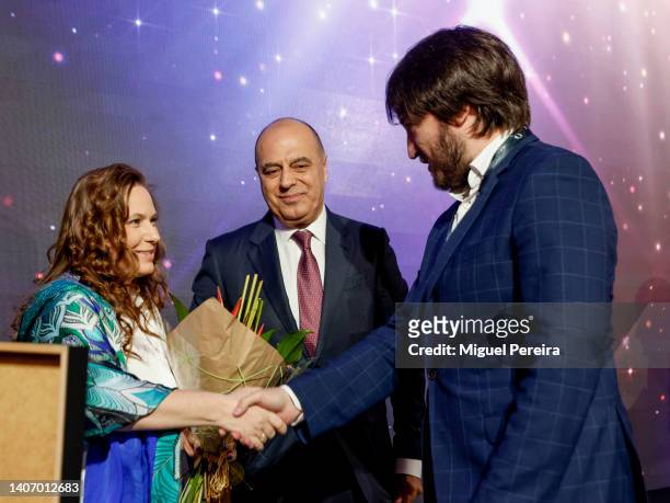 Hungarian chess grandmaster Judit Polgár congratulates Grandmaster Teimour Radjabov of Azerbaiyán as FIDE Vice President Mahir Mammedov looks on...