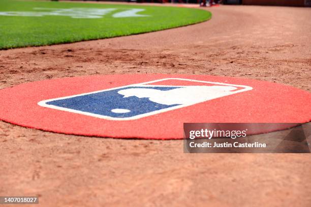 The MLB logo on the field during the game between the Atlanta Braves and the Cincinnati Reds at Great American Ball Park on July 03, 2022 in...