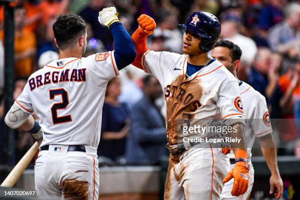 Jeremy Pena of the Houston Astros celebrates with Alex Bregman of the Houston Astros after hitting a solo game tying home run in the fourth inning...