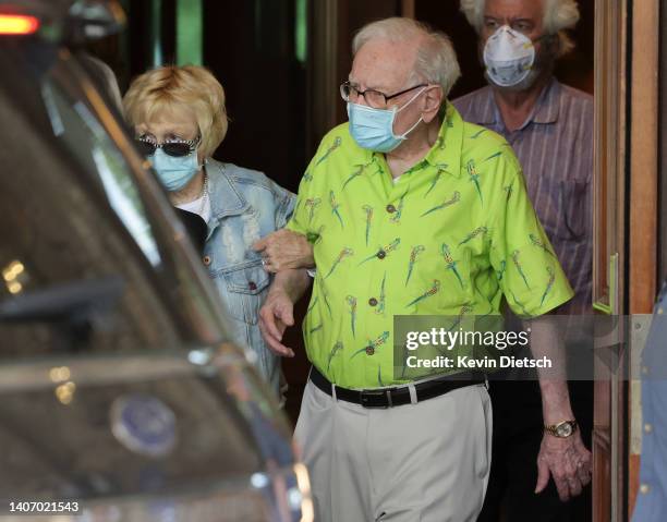 Warren Buffett, CEO of Berkshire Hathaway, and his wife Astrid Monks arrive at the Sun Valley Resort for the Allen & Company Sun Valley Conference on...