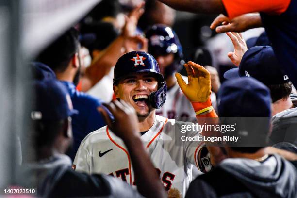 Aledmys Diaz of the Houston Astros celebrates in the dugout after hitting a two-run home run in the 7th inning against the Kansas City Royals at...