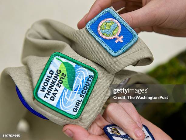 February, 22:Chaya Blonder shows the badges that the Girl Scouts earned Wednesday February 22, 2012 in Silver Spring, MD. The one on the right is the...