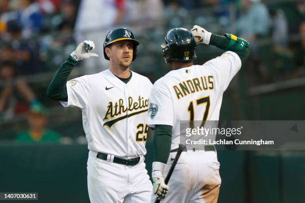 Stephen Piscotty of the Oakland Athletics celebrates his solo home run with Elvis Andrus in the bottom of the fifth inning against the Toronto Blue...