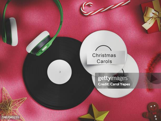 top view music cd and  vinyls with  the label christmas  carols.xmas music concept - christmas photo album stock pictures, royalty-free photos & images