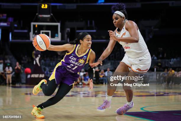 Jordin Canada of the Los Angeles Sparks handles the ball defended by Reshanda Gray of the Phoenix Mercury in the first half at Crypto.com Arena on...