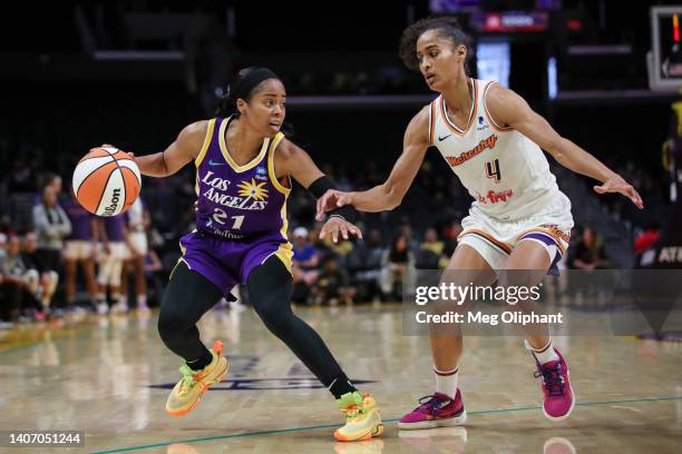 Jordin Canada of the Los Angeles Sparks handles the ball defended by Skylar Diggins-Smith of the Phoenix Mercury in the first half at Crypto.com...