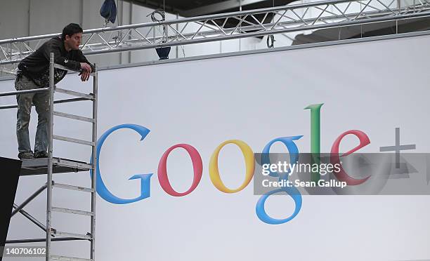 Worker pauses while preparing the Google stand the day before the CeBIT 2012 technology trade fair officially opens to the public on March 5, 2012 in...