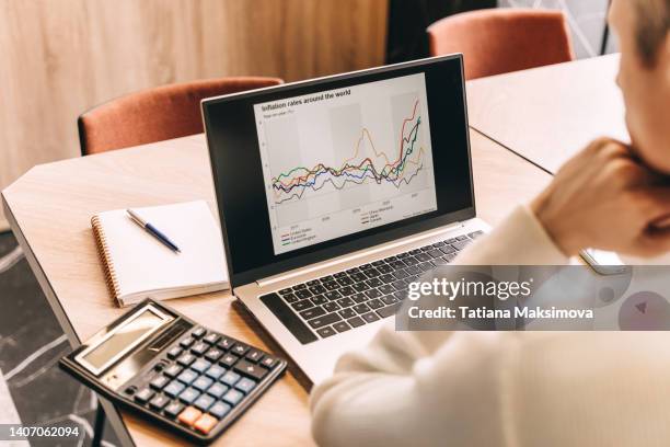 businessman work in cafe with laptop. inflation chart on the screen. - guy looking down stock pictures, royalty-free photos & images