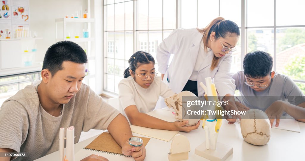 Childhood students and friends learning science in classroom lab