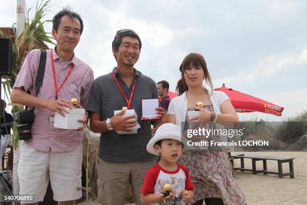 Yuko Sugimoto and family on September 3, 2011 during 2011 Visa Festival, on Paris Match beach in Perpignan, France. In March 2011, an earthquake...