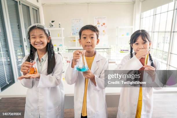 childhood students and friends learning science in classroom lab - children in a lab stock pictures, royalty-free photos & images