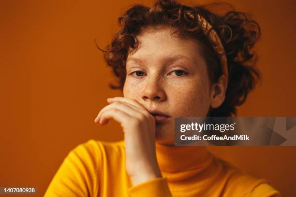 beautiful woman with freckles - autumn sadness stock pictures, royalty-free photos & images