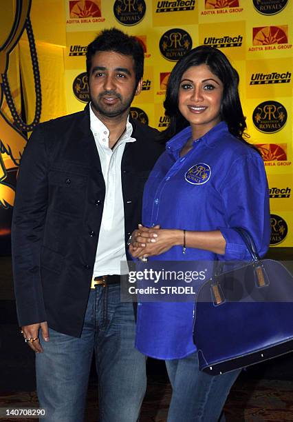 Raj Kundra and his wife Indian Bollywood actress Shilpa Shetty pose at the unveiling of the IPL 2012 cricket team Rajsthan Royals' jersey in Mumbai...