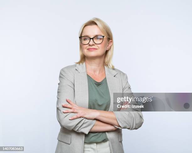portrait of confident mature women - looking away stock pictures, royalty-free photos & images