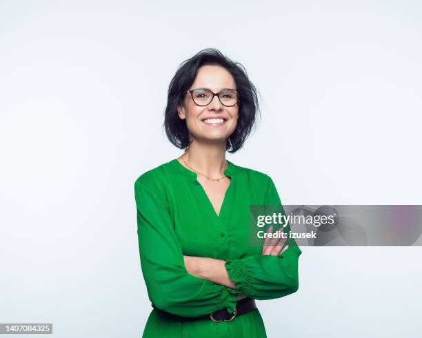 portrait of happy mature women - folded arms stockfoto's en -beelden