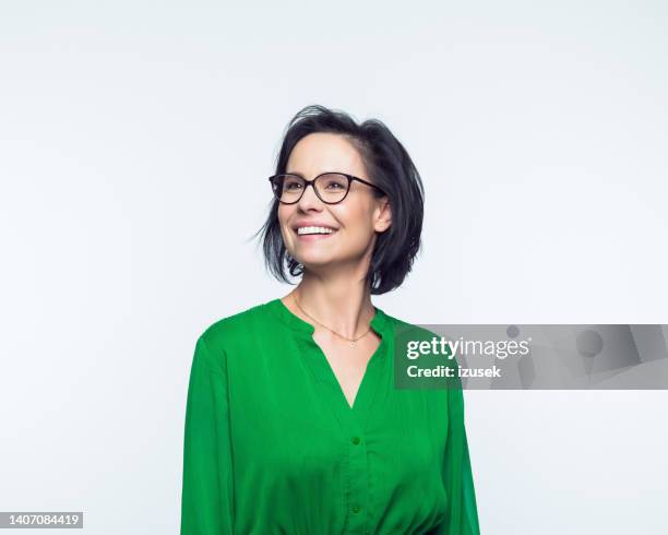 portrait of happy mature women - green dress stock pictures, royalty-free photos & images