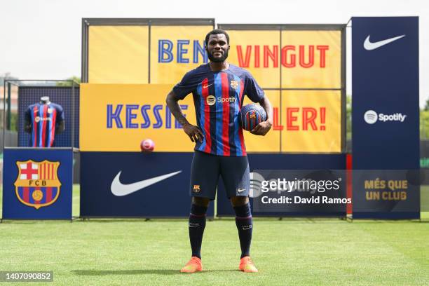 Franck Kessie poses for the media as he is presented as a FC Barcelona player at Ciutat Esportiva Joan Gamper on July 06, 2022 in Sant Joan Despi,...