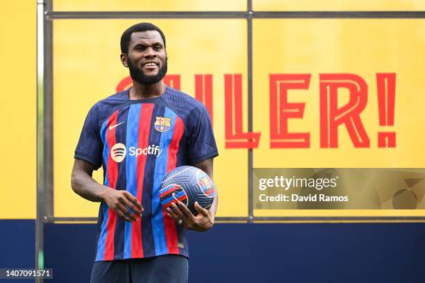 Franck Kessie poses for the media as he is presented as a FC Barcelona player at Ciutat Esportiva Joan Gamper on July 06, 2022 in Sant Joan Despi,...