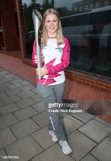 Baton bearer Amy Broadfoot holds the Queen's Baton during the Birmingham 2022 Queen's Baton Relay at a visit to Maidenhead, United Kingdom on July...