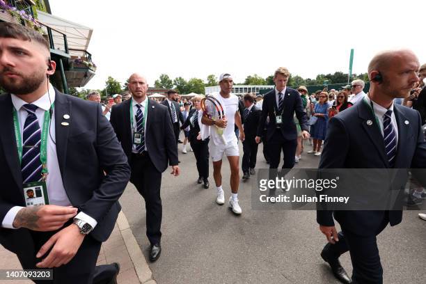 Rafael Nadal of Spain walks off the practice court after a training session on day ten of The Championships Wimbledon 2022 at All England Lawn Tennis...