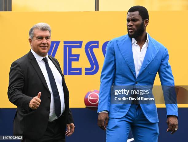 Franck Kessie and FC Barcelona President Joan Laporta pose for the media as he is presented as a FC Barcelona player at Ciutat Esportiva Joan Gamper...